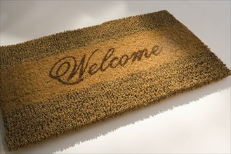 Closeup of a welcome mat.