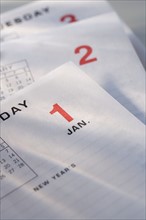 Still life of calendar pages of a new year.