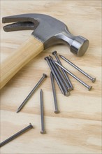 Closeup of hammer and nails.