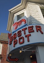 Neon sign for Lobster Pot restaurant.