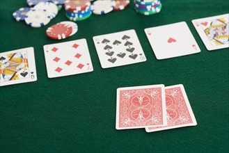 Poker hand and chips.
