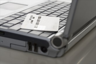 Laptop computer and credit card.