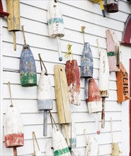 Buoys on a wall in Maine.