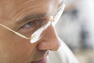 Closeup of man wearing glasses.