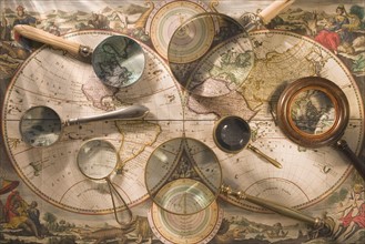 Still life of old map with magnifying glasses.