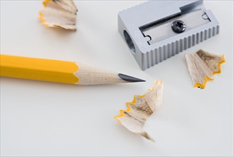 Pencil and sharpener with shavings.