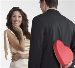 Man surprising woman with valentine.