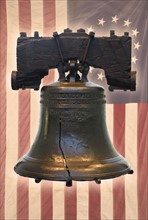 Liberty Bell and American flag with thirteen stars.