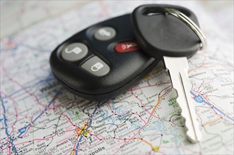 Closeup of car keys and map.