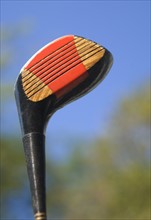 Closeup of a golf club.