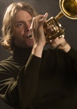 Man playing the trumpet.