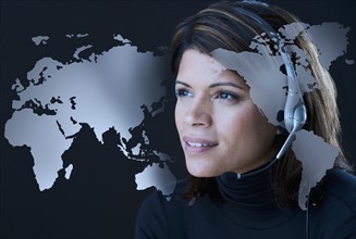 Woman wearing headset with map of world.