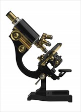An old fashioned microscope.