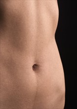 Nude female torso.