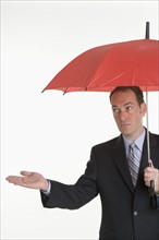 Man holding an umbrella.