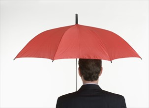 Man holding an umbrella.