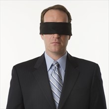 Man wearing blindfold.