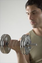 Man using free weights.