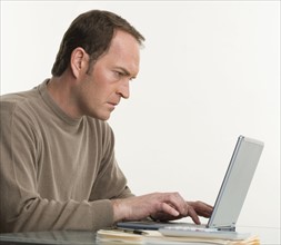 Portrait of a man at his computer.