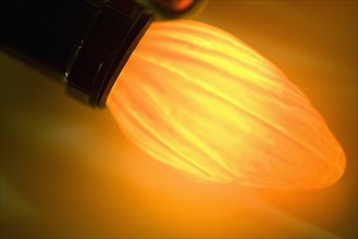 Closeup of a glowing Christmas light bulb.