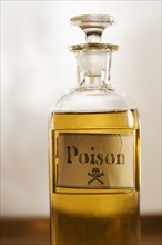Still life of a bottle of poison.