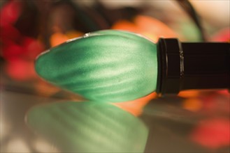 Closeup of a glowing Christmas light bulb.