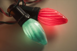 Closeup of glowing Christmas light bulbs.