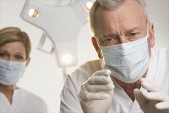 Portrait of dentist with hygienist.