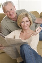 Portrait of couple relaxing at home.