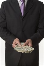 Man holding American money.