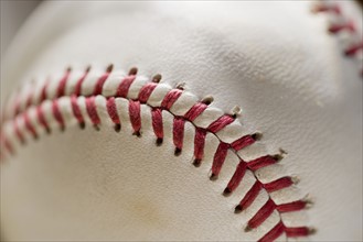 Closeup of stitching on a baseball.