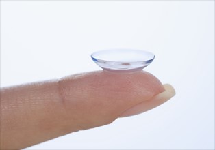 Finger with contact lens.