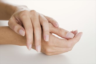 Closeup of woman's hands.