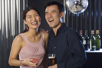 Couple having drinks in a bar.