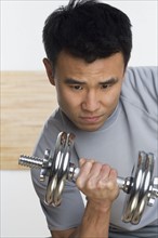 Man lifting free weights.