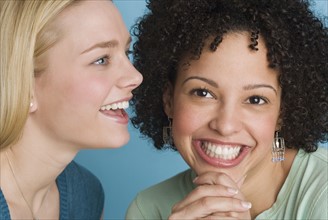 Closeup of two smiling women.