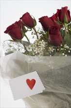 Red roses with valentine card.