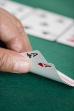 Close up of pair of aces on poker table.