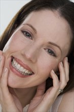 Close up of woman smiling.