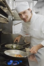 Male chef in restaurant kitchen.