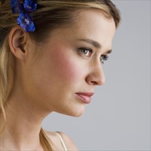 Young woman wearing a hair ornament.