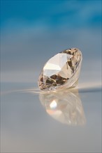 Closeup of a sparkly clear faceted gem.