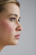 Portrait of young woman in profile.