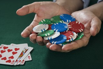 Man with winning poker hand.