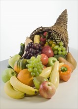Fruits and vegetables in cornucopia basket.