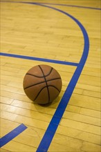 Close up of basketball on basketball court.