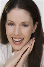 Close up of woman laughing.