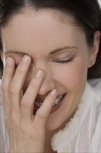 Close up of woman laughing.