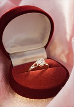 Still life of diamond engagement ring.