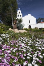 Meadow with church in background, Mission San Diego de Alcala, San Diego, California, United States.
